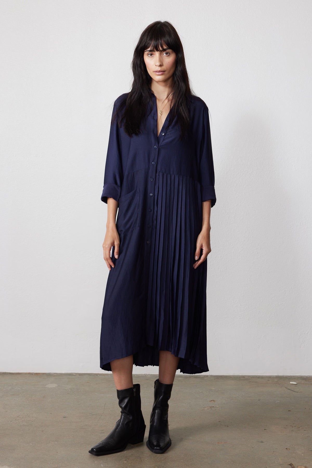 Ink pleated long-sleeve dress with button front, falling one-side pleats, midi length