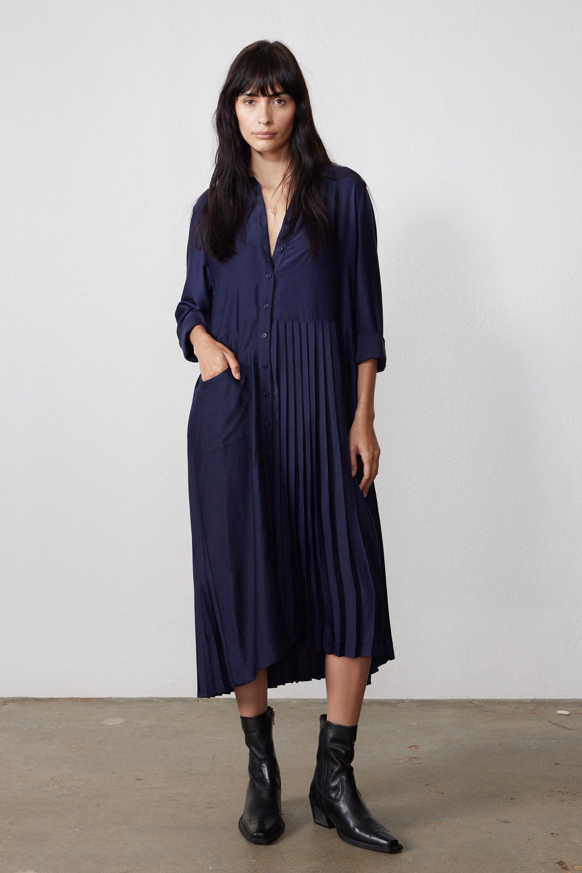 Ink pleated long-sleeve dress with button front and vertical one-side pleats, midi