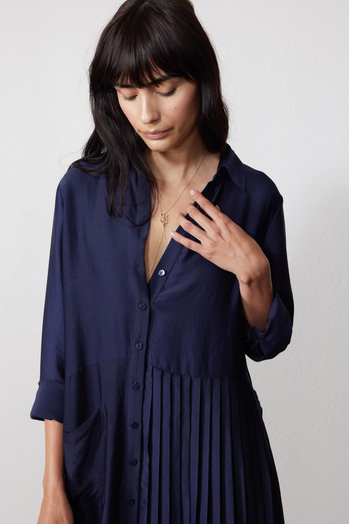 Ink long-sleeve dress with collar, button front, and pleated one-side skirt