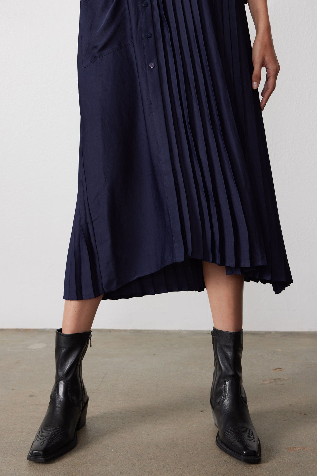 Ink pleated midi dress hem with vertical one-side pleats and draped panels