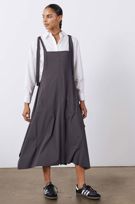 Graphite midi sarafan dress with wide bib, side pockets, and buttoned straps
