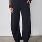 Black loose work pants with wide leg and front pleats