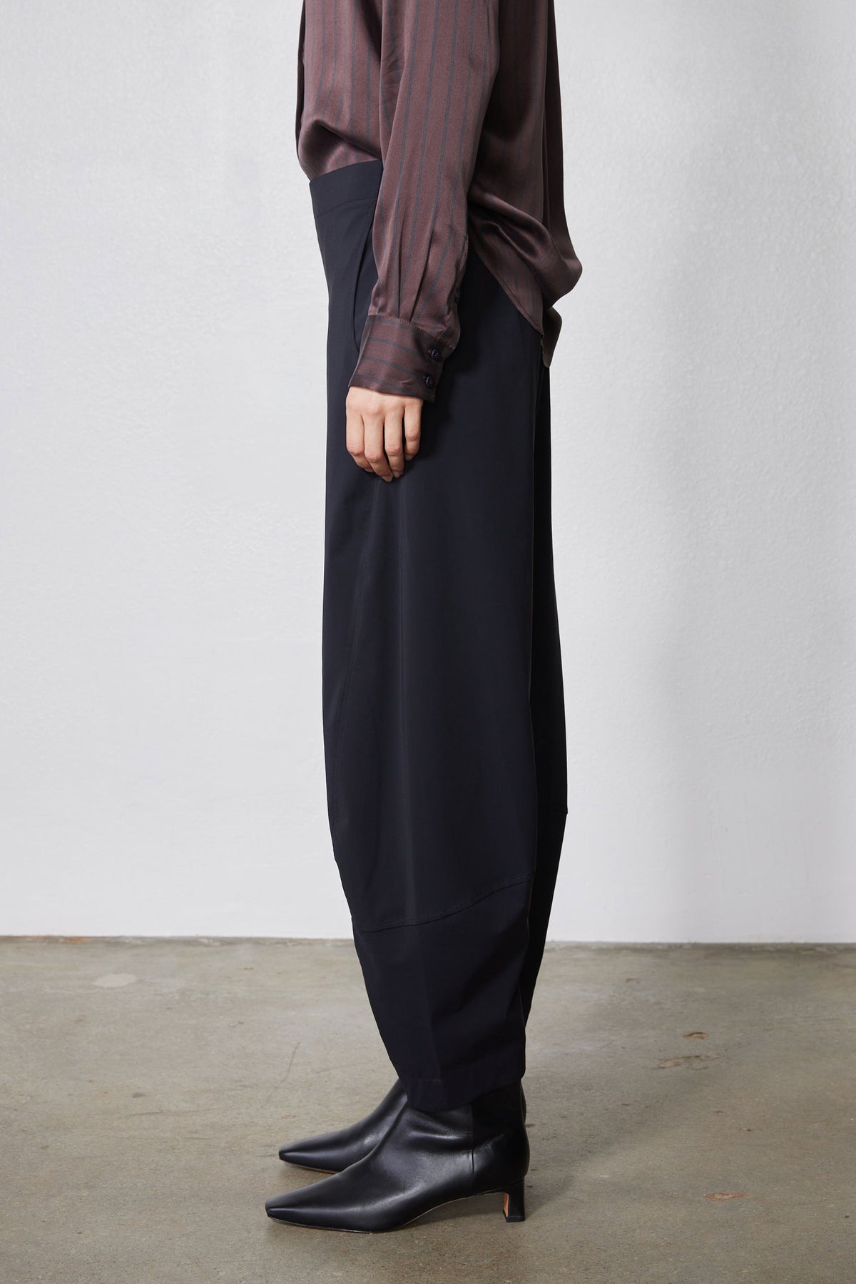 Black wide-leg work pants with relaxed fit and side view