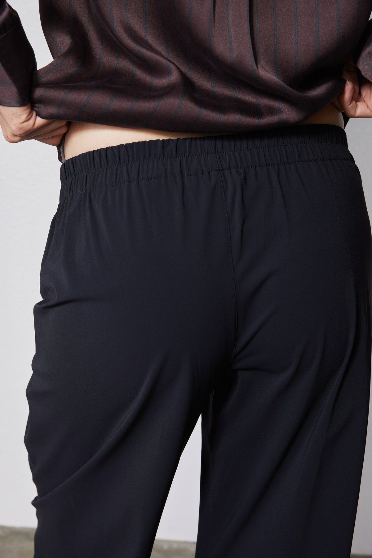 Black work pants with elastic waistband and relaxed drape