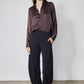 Black work pants with relaxed wide-leg silhouette on model