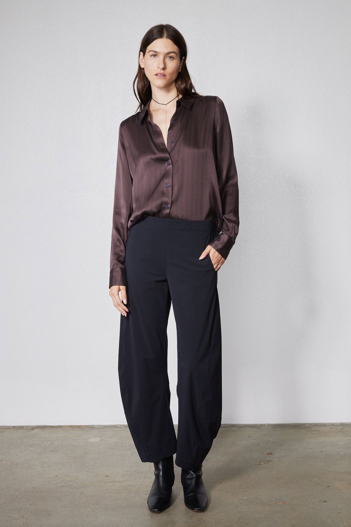 Black work pants with relaxed wide-leg silhouette on model