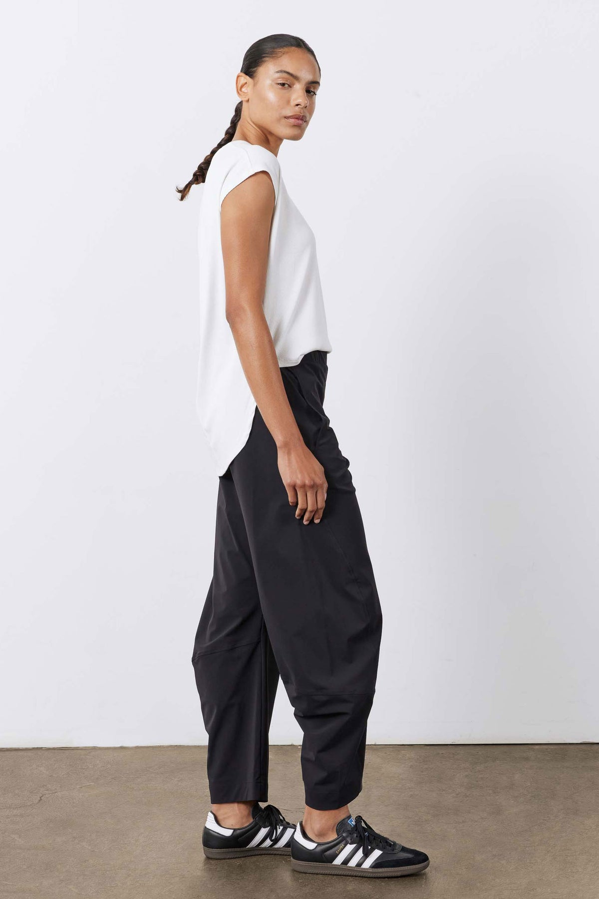 Black loose work pants with elastic waistband and relaxed straight legs