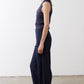 Navy loose work pants, side view with elastic waist and wide leg drape