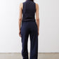 Back view of navy loose work pants with elastic waistband and wide leg opening