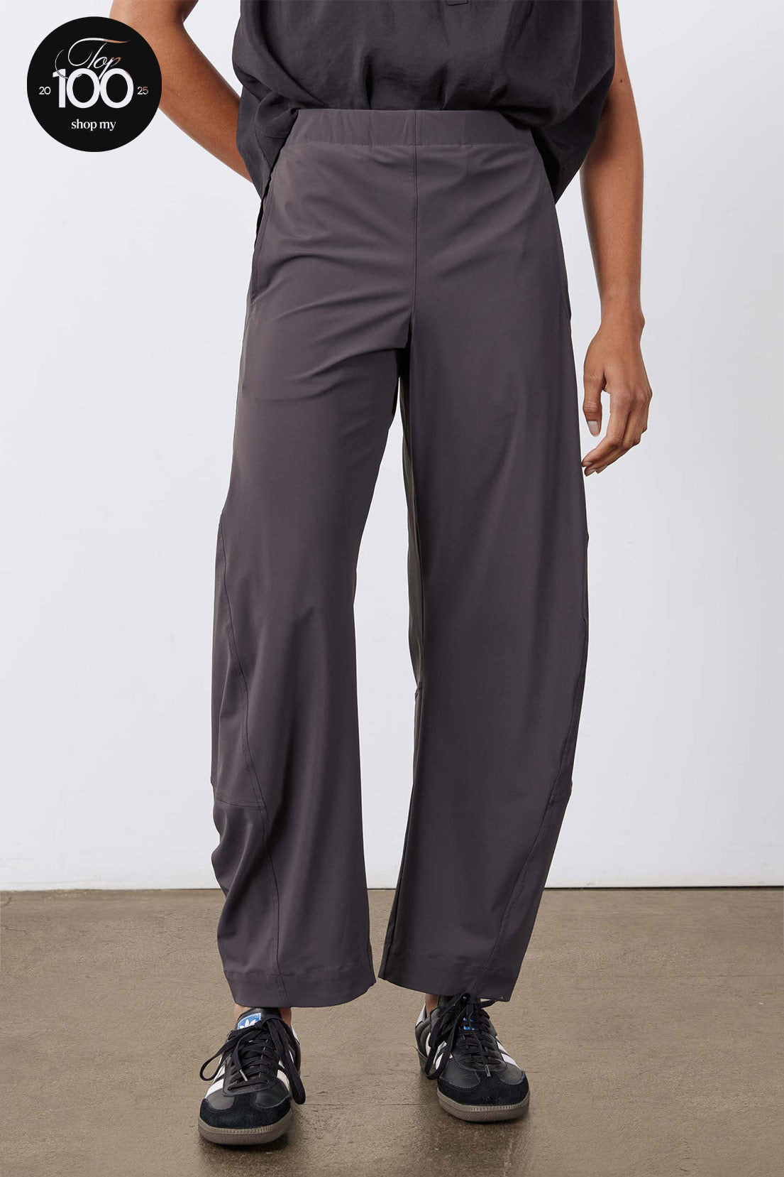 Graphite work pants with elastic waistband, front crease, and wide fit