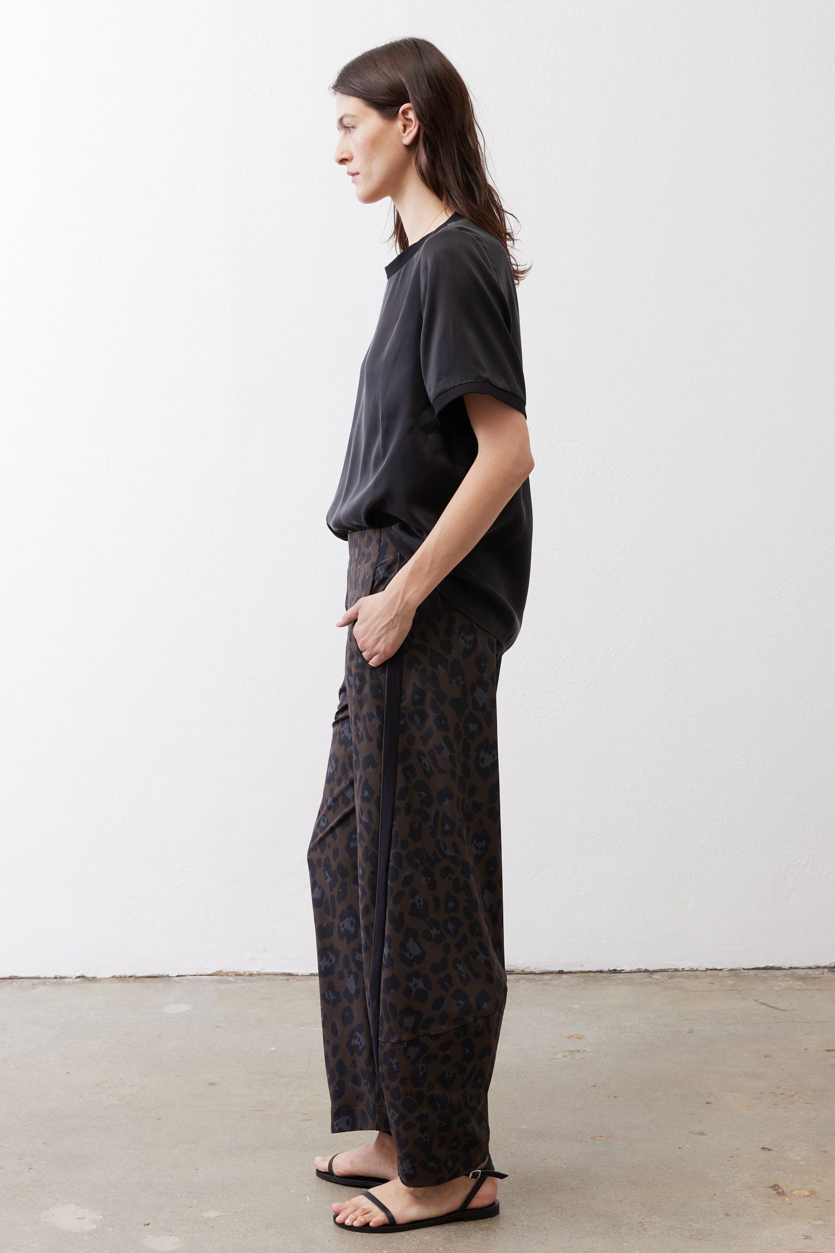 Loose work pants in dark leopard print with relaxed straight legs and elastic waist