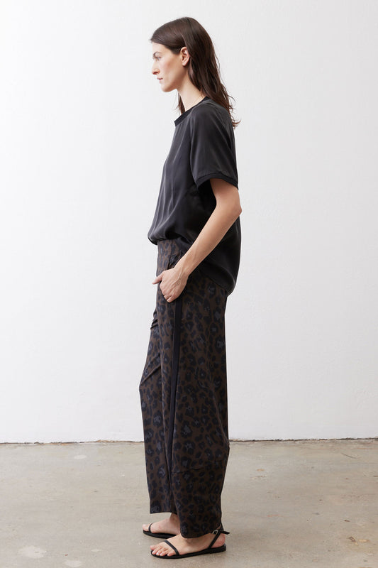 Loose work pants in dark leopard print with relaxed straight legs and elastic waist