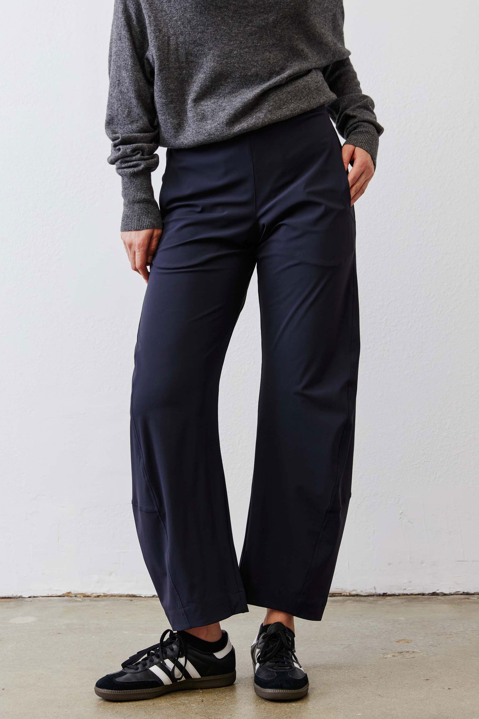 Petite dark navy work pants with relaxed straight legs and side seam pockets.
