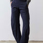 Petite dark navy work pants, relaxed straight leg with elastic waist and ankle hem.