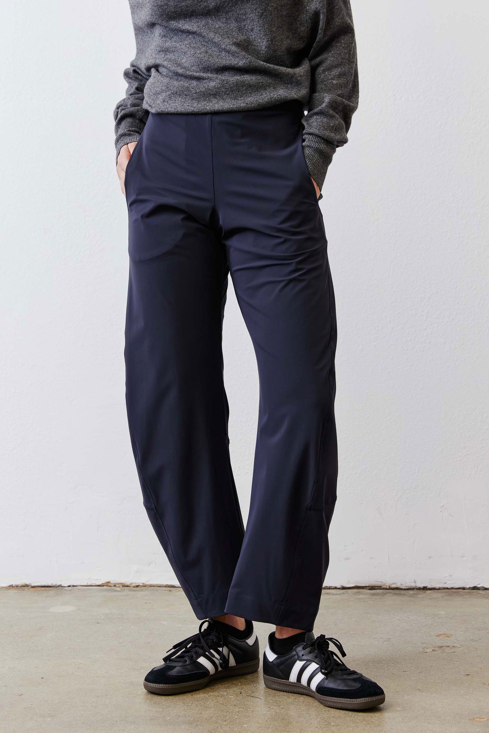 Petite dark navy work pants, relaxed straight leg with elastic waist and ankle hem.