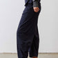 Petite dark navy work pants with gathered elastic waist and cuffed ankle hem.