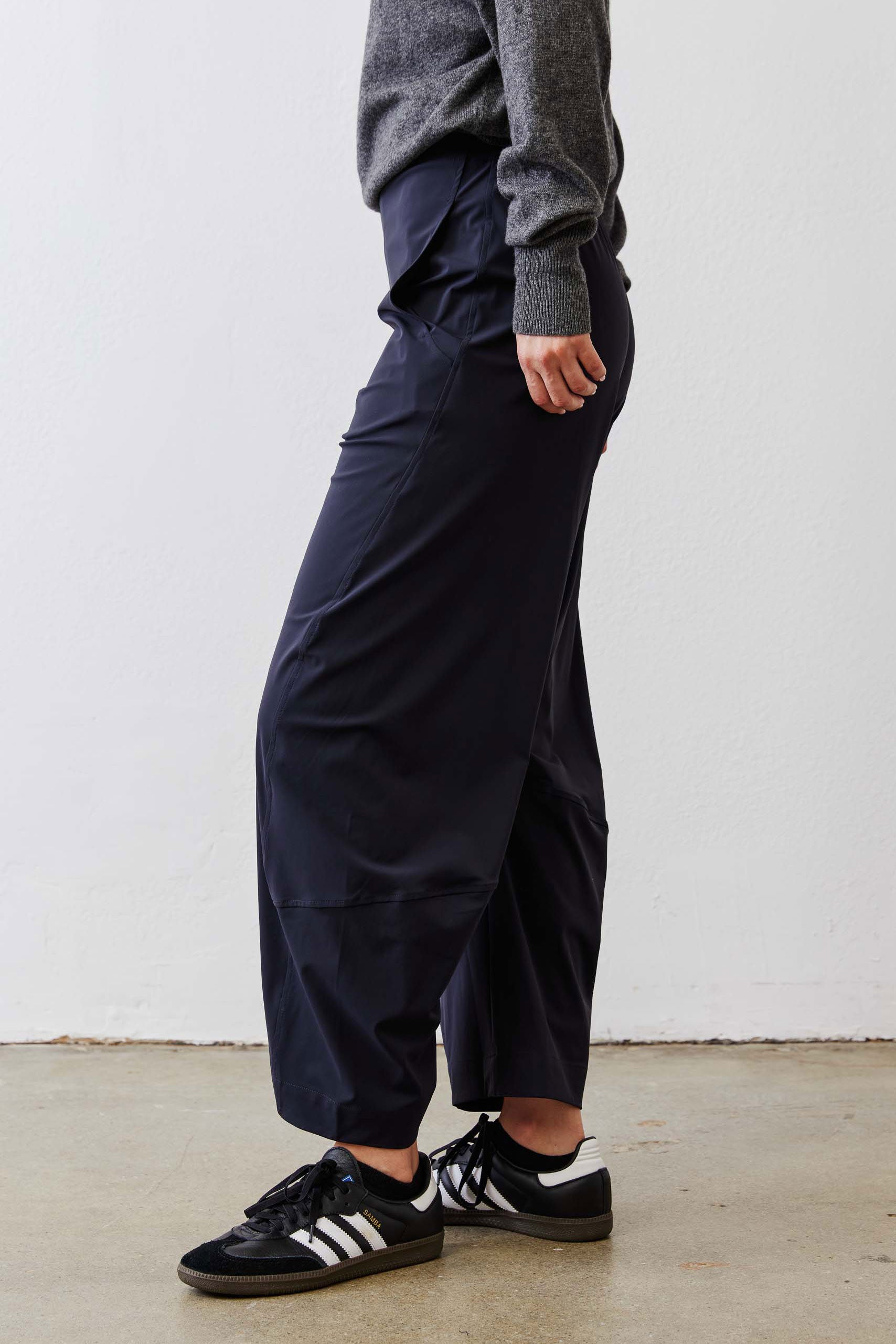 Petite dark navy work pants with gathered elastic waist and cuffed ankle hem.