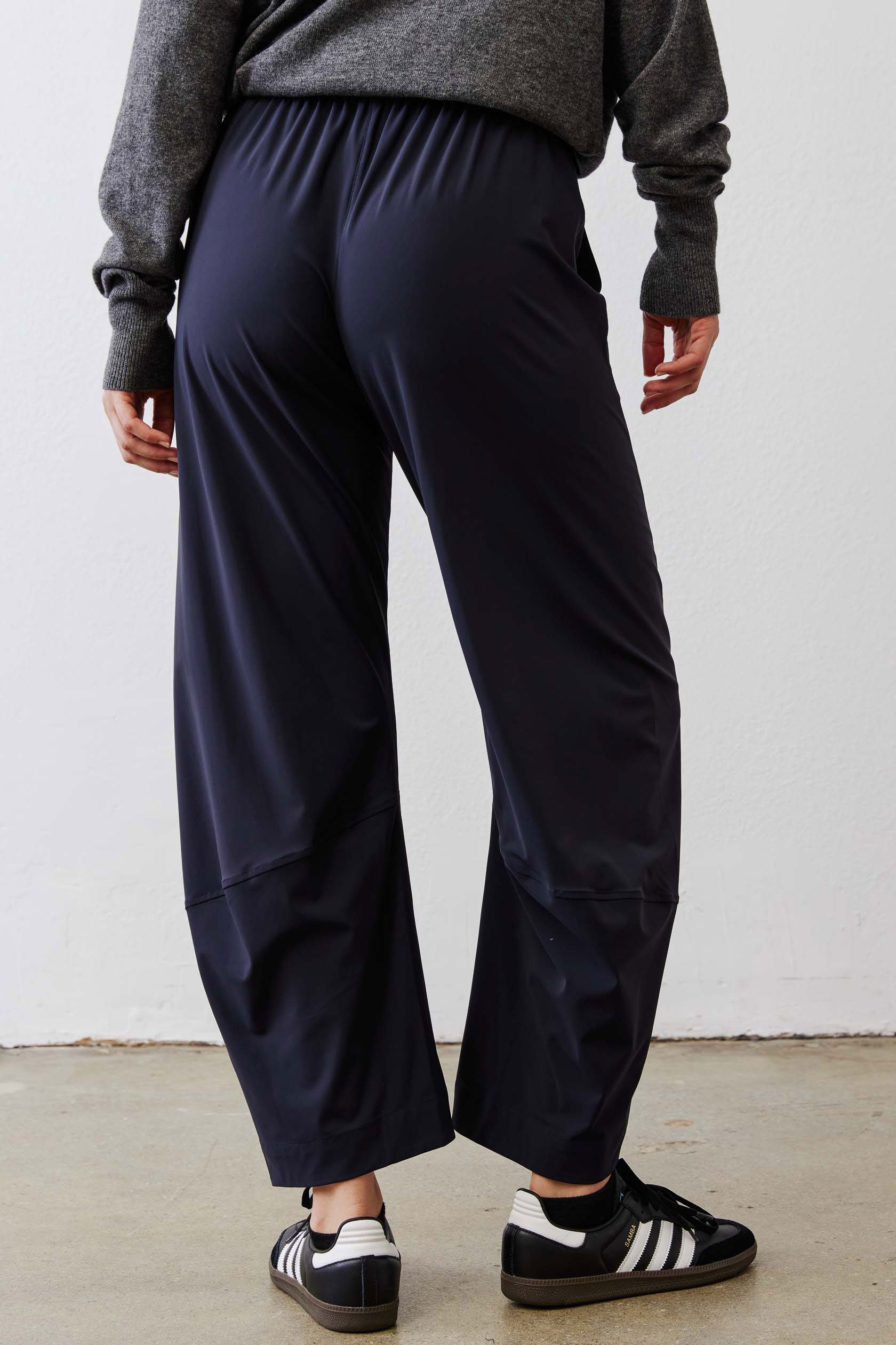 Petite dark navy work pants with elastic waist and relaxed wide legs.