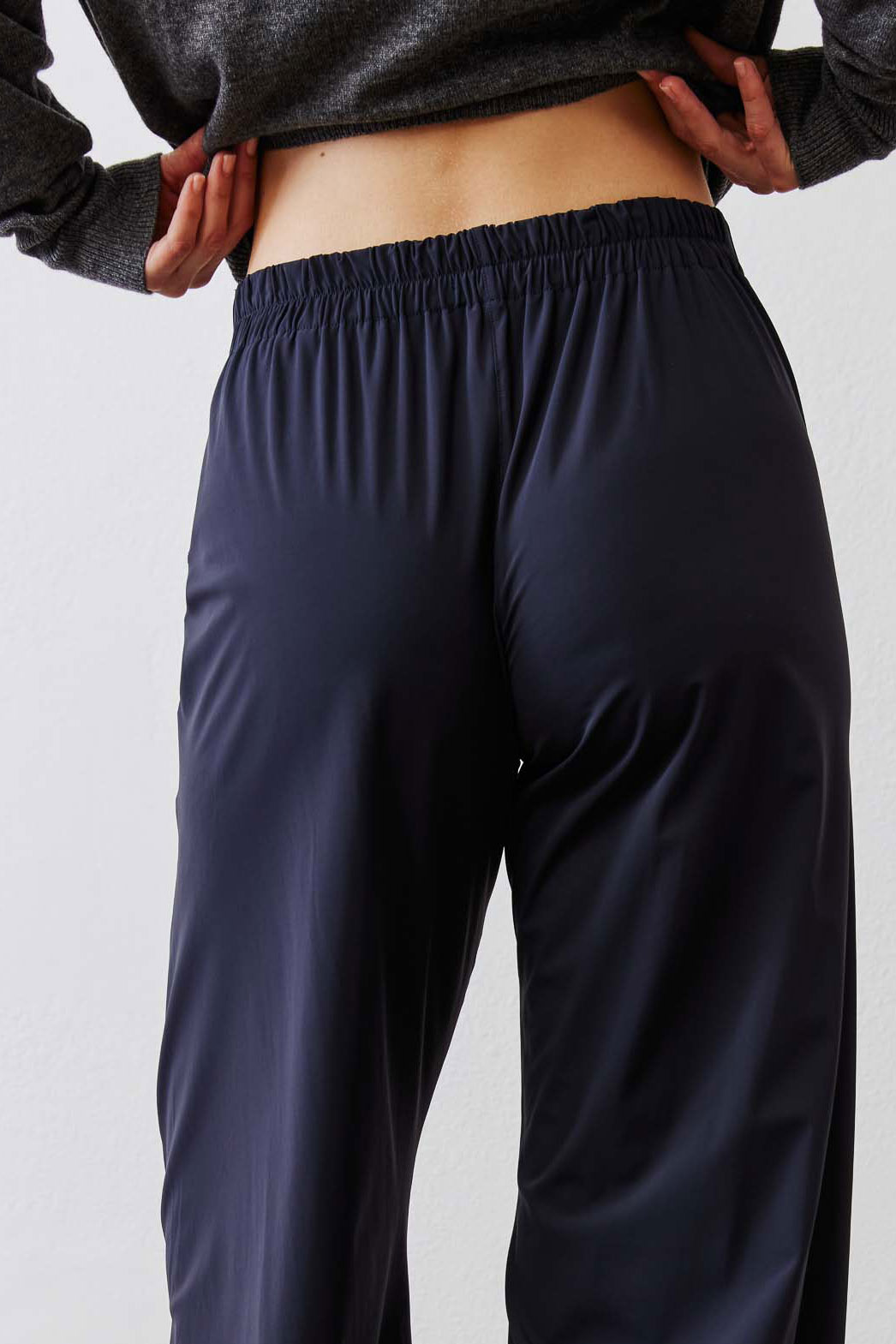 Dark navy work pants with wide elastic waistband and relaxed straight-leg fit.