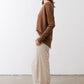 Light beige loose work pants shown from the side with relaxed straight-leg fit