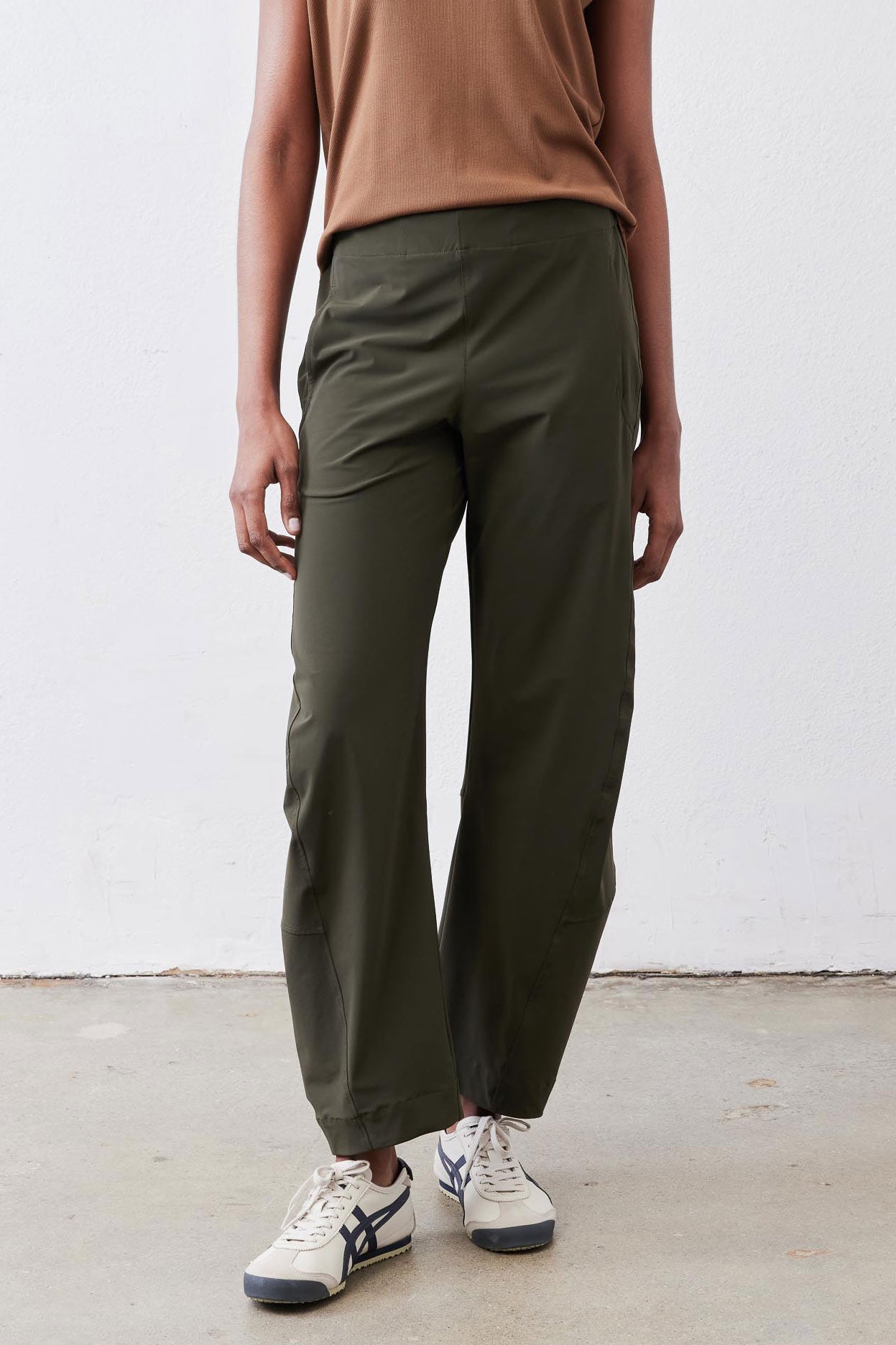 Olive work pants with tapered legs and relaxed waist, front view