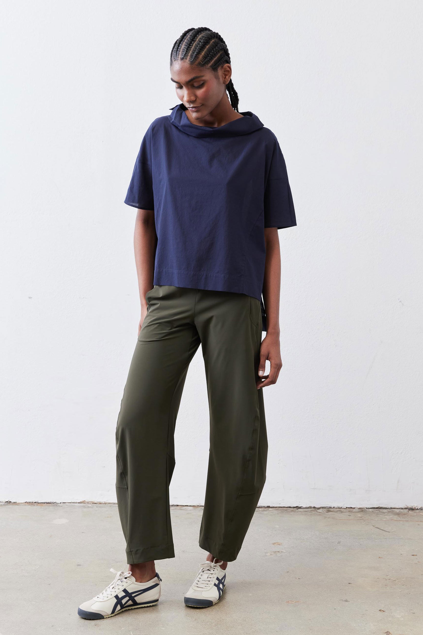 Olive work pants with slightly cropped ankle length and relaxed fit