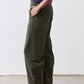 Olive green loose work pants with patch pocket and tapered ankle-length leg