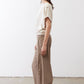 Tan relaxed work pants, side view; elastic waistband and straight tapered legs