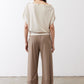 Tan work pants from back view with elastic waist and tapered ankle cuffs