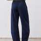 Navy loose work pants front view with elastic waist and wide legs, ankle length