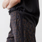 Loose work pants with leopard print side stripe and drawstring waist.