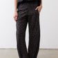 Loose work pants in dark leopard print with elastic waistband and ankle-length relaxed fit