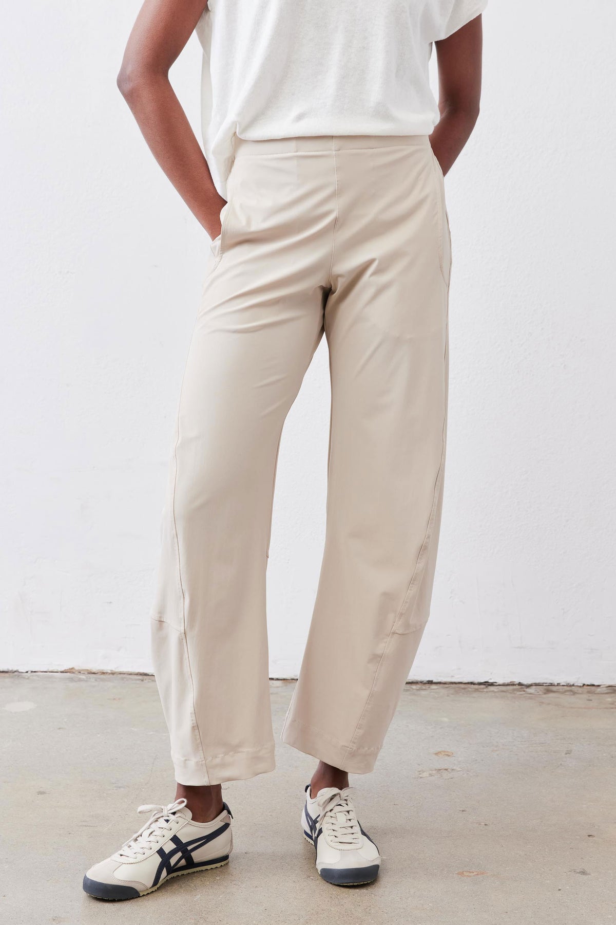 Light beige work pants, relaxed ankle-length straight leg with elastic waistband
