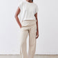Light beige loose work pants with relaxed rise, straight legs, and ankle hem