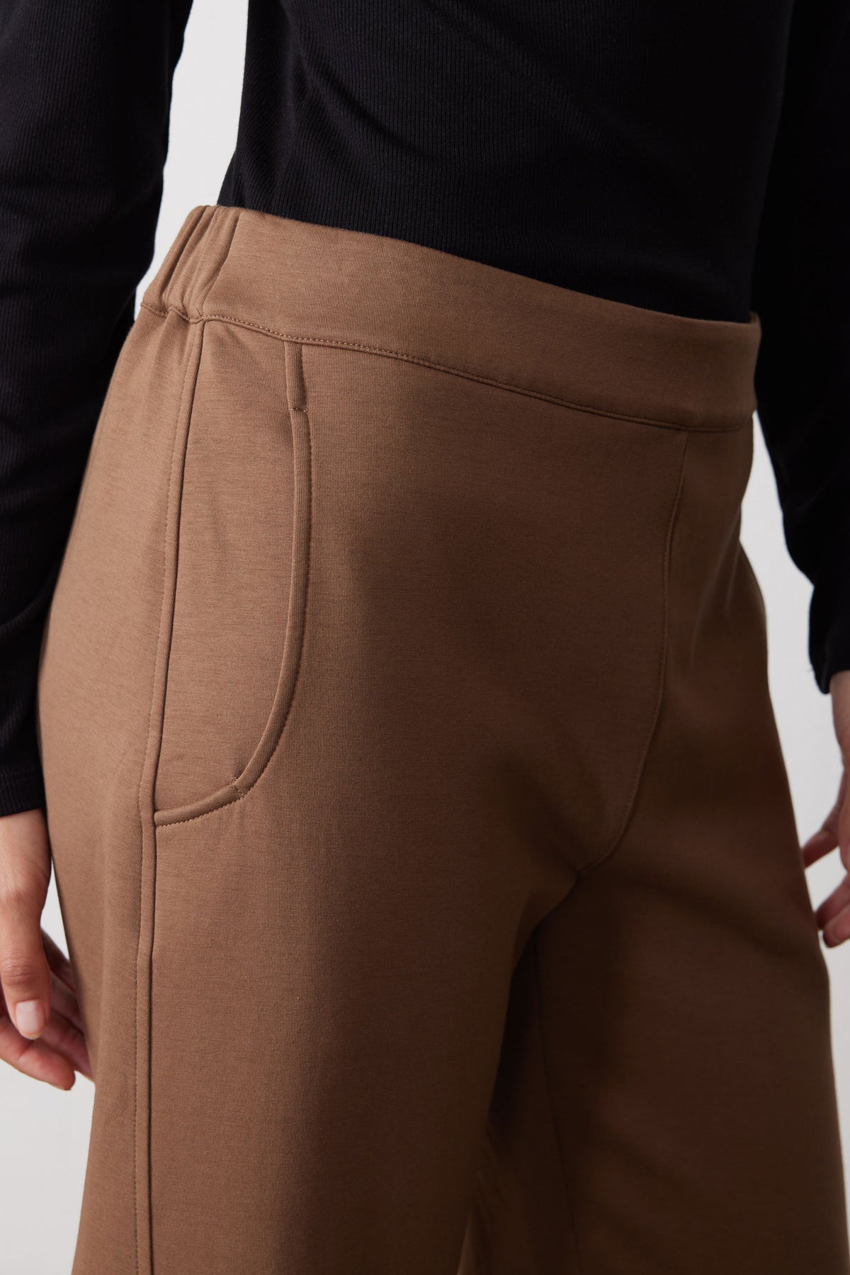 Mocha work scuba pants with front pocket seam detail and drawstring-like edging