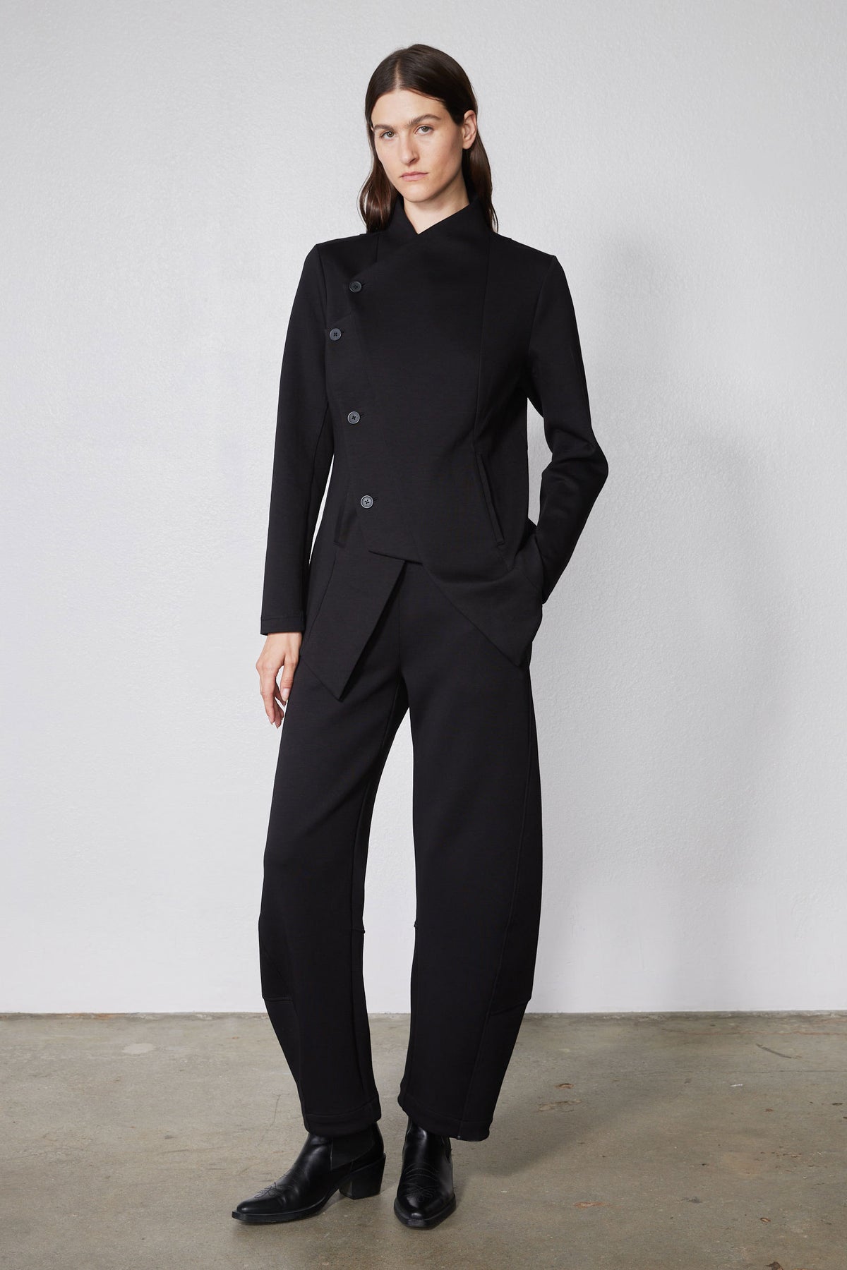 Black asymmetric scuba jacket with stand collar and snap-button front