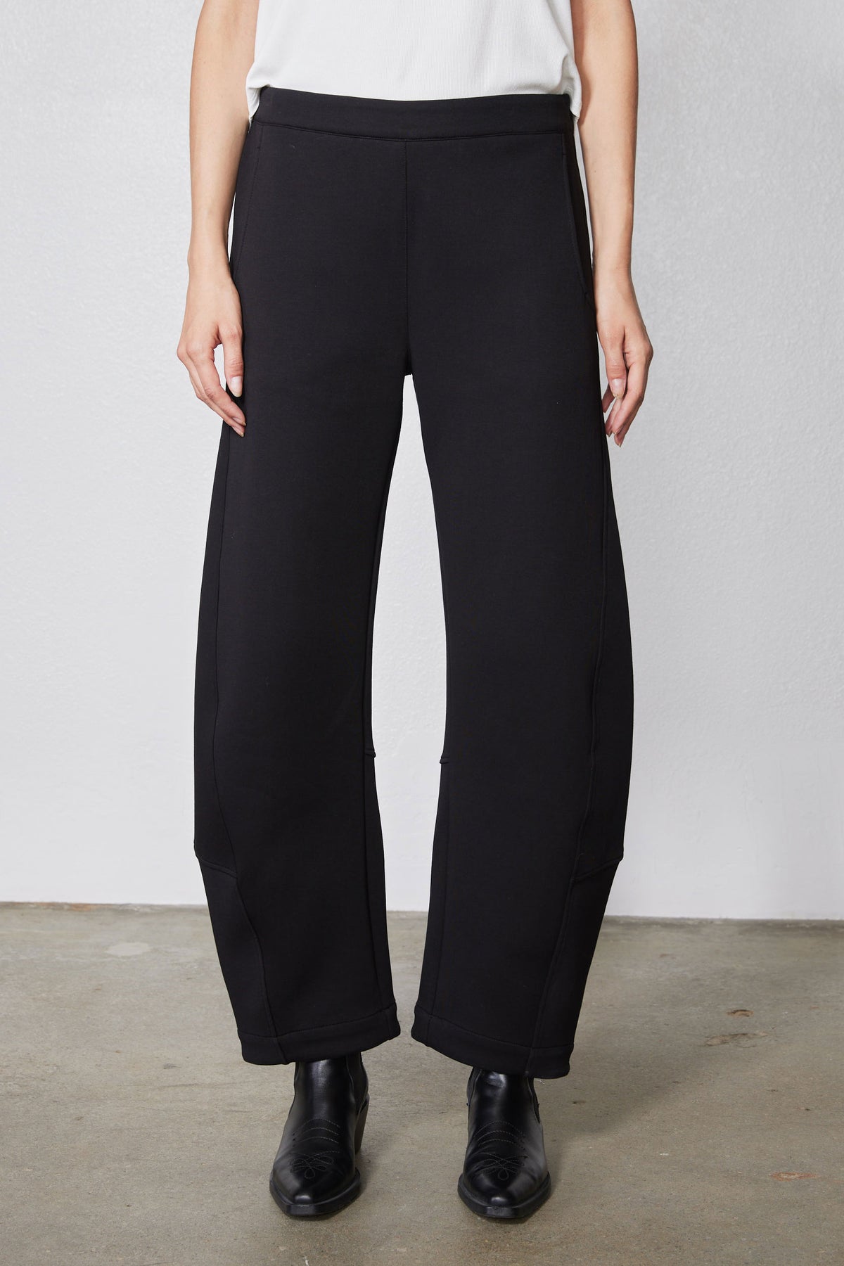 Black work scuba pants front view with wide straight legs and ankle hem
