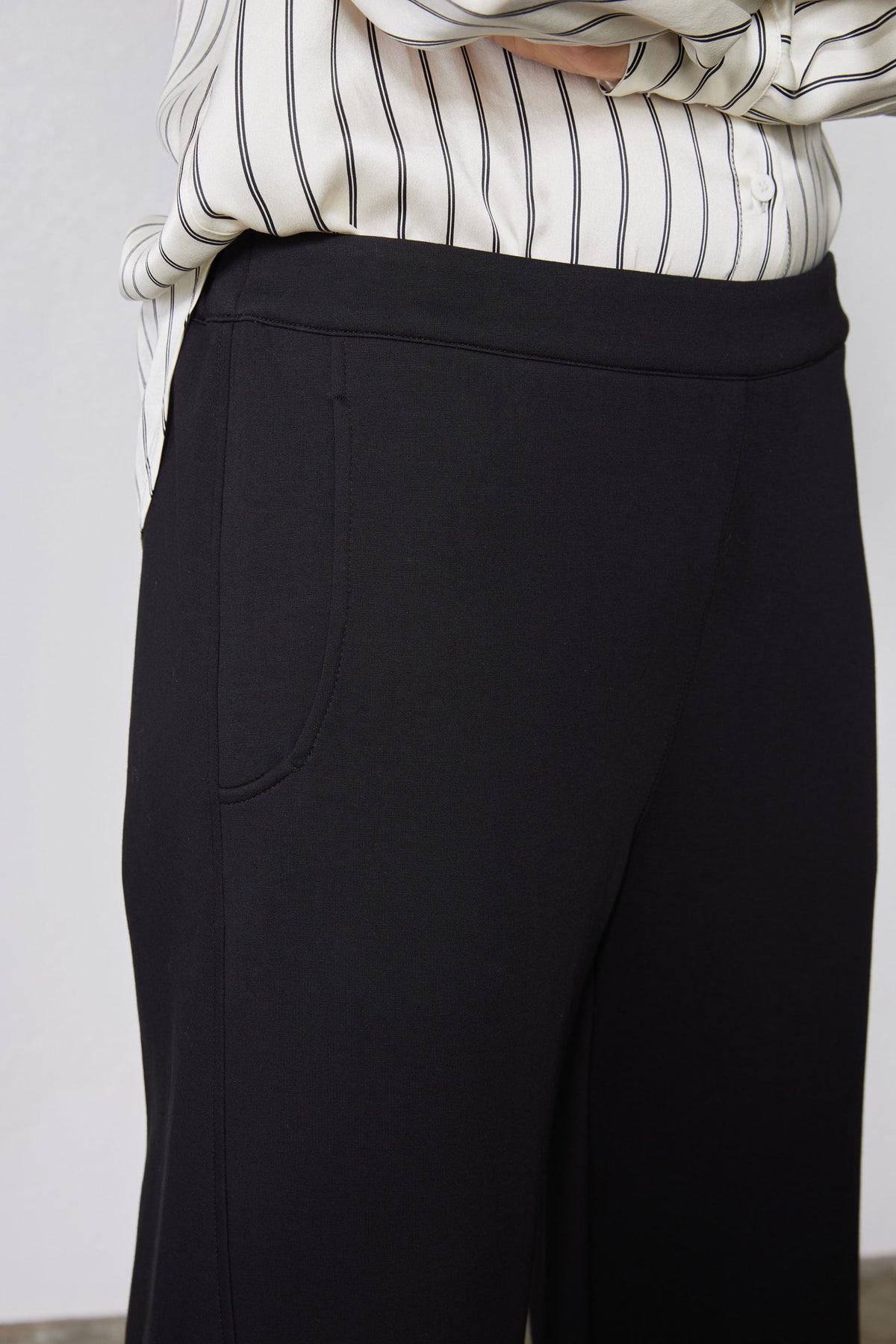 Black work scuba pants close-up of waistband and side seam
