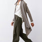 Sea gray open-knit cardigan with asymmetrical hem and draped front over shirt