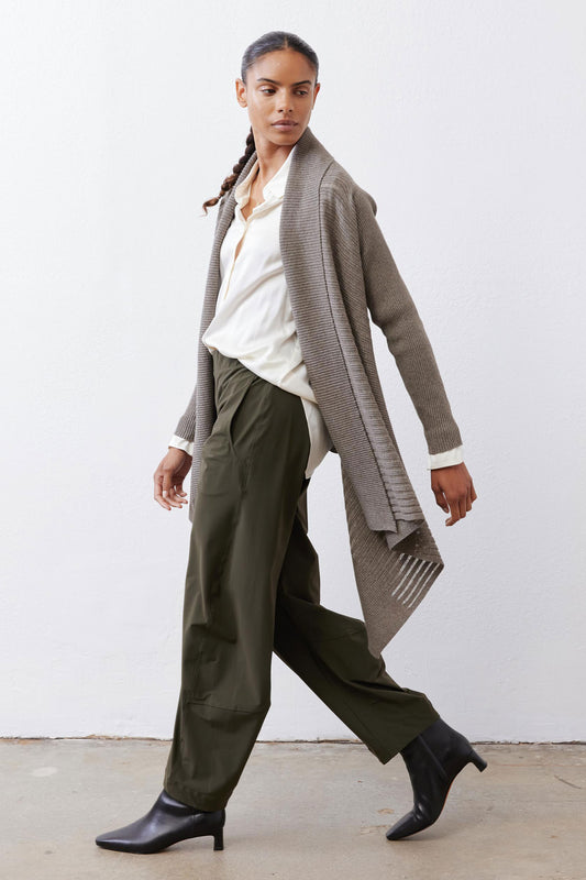 Sea gray open-knit cardigan with asymmetrical hem and draped front over shirt
