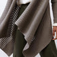 Sea gray open-knit cardigan close-up showing draped hem and knit texture