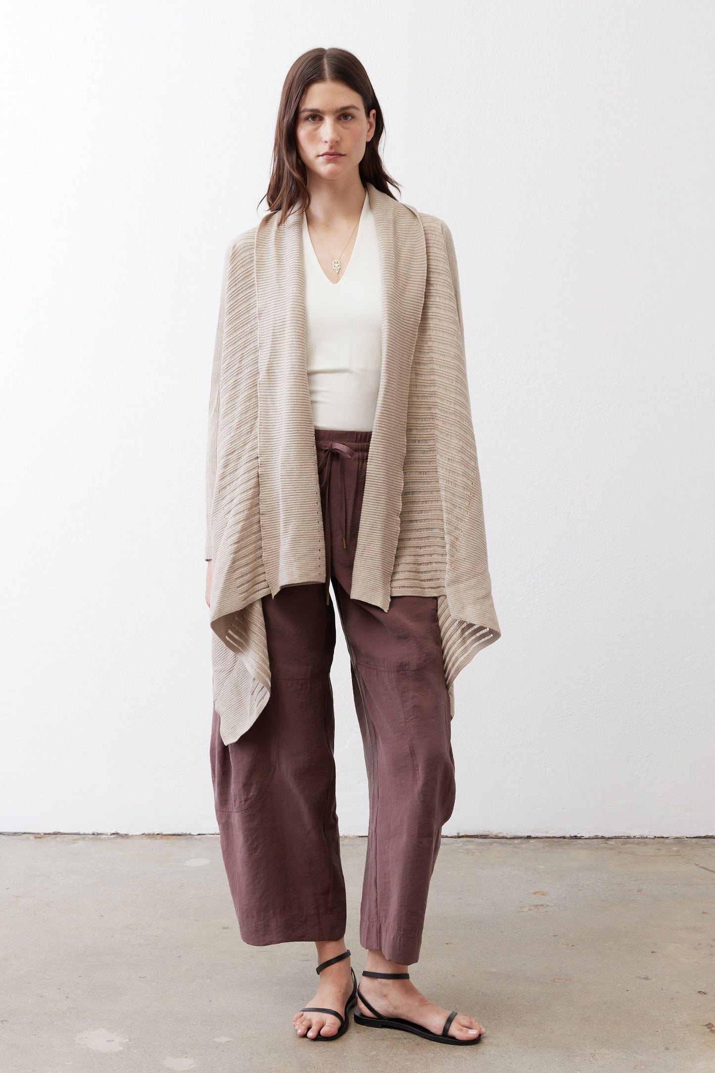 Open knit cardigan in light beige, open front with draped hem, long sleeves