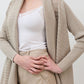 Open knit cardigan in light beige, close-up of draped neckline and long sleeves