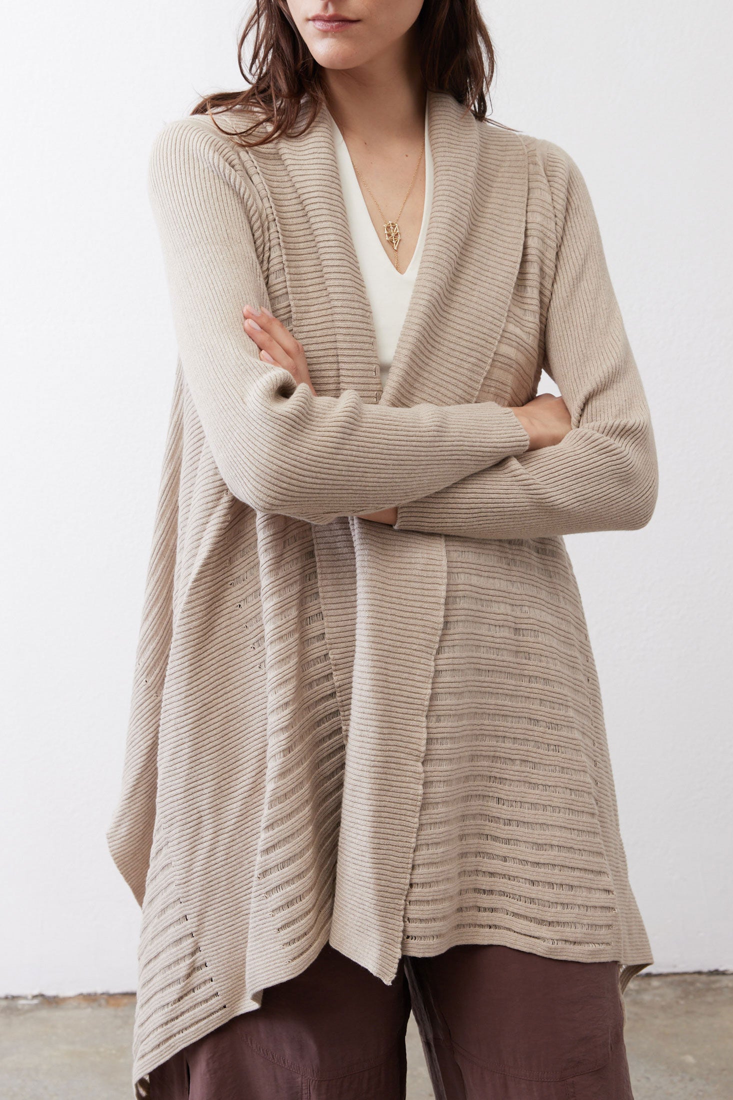 Light beige open knit cardigan with textured stripes and draped open front