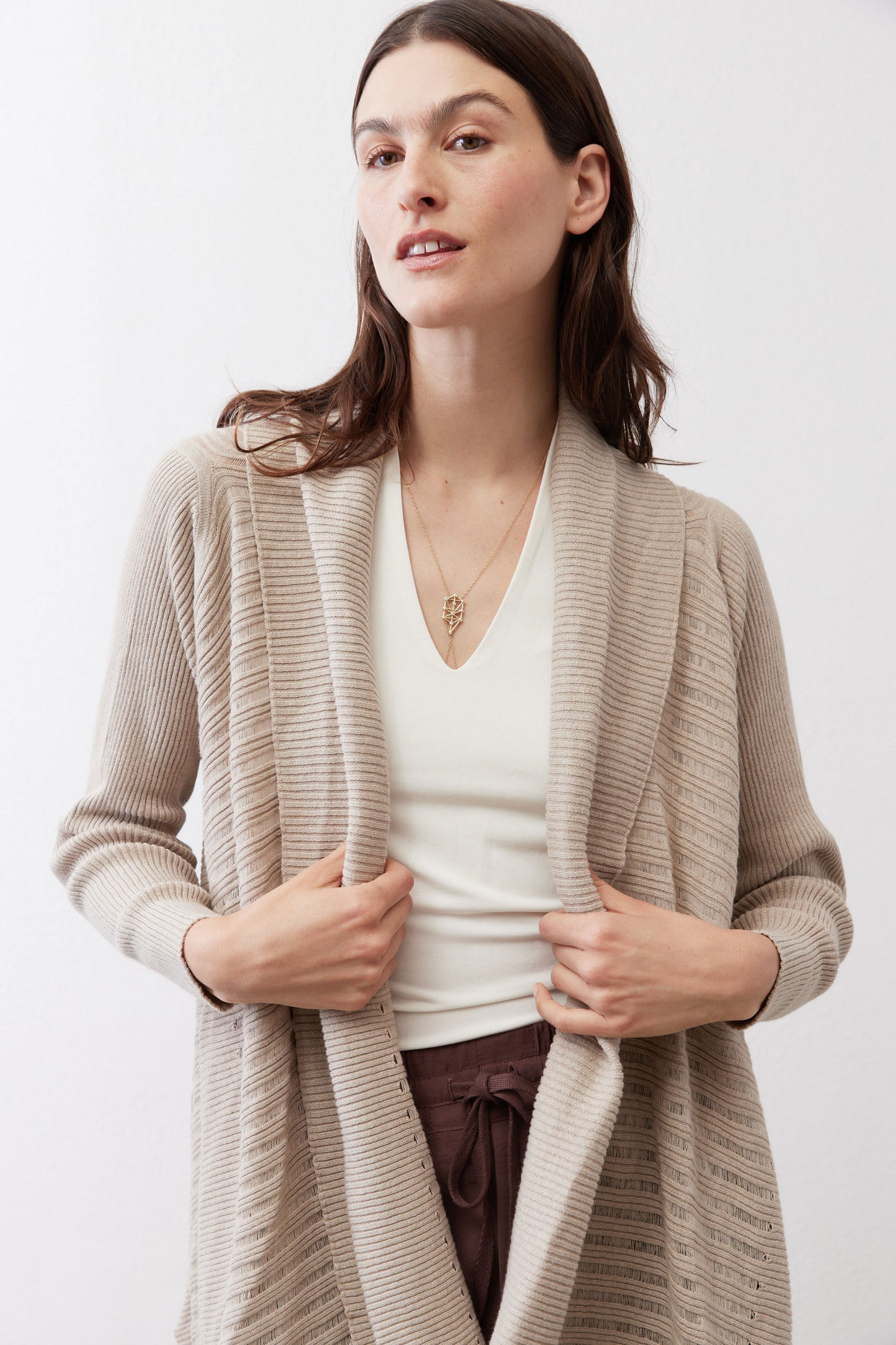 Open knit cardigan in light beige with long sleeves and open drape front