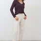 Lace-trim V-neck long sleeve top in dark plum, worn with light jeans