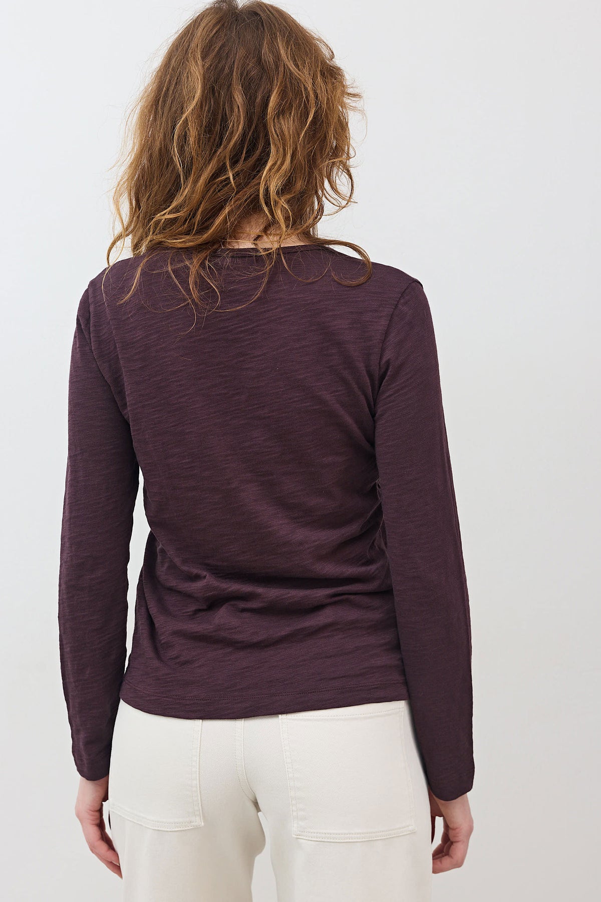 Burgundy long-sleeve V-neck lace-trim top, back view