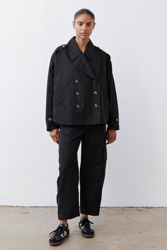 Black cargo barrel pants with relaxed legs and side cargo pocket