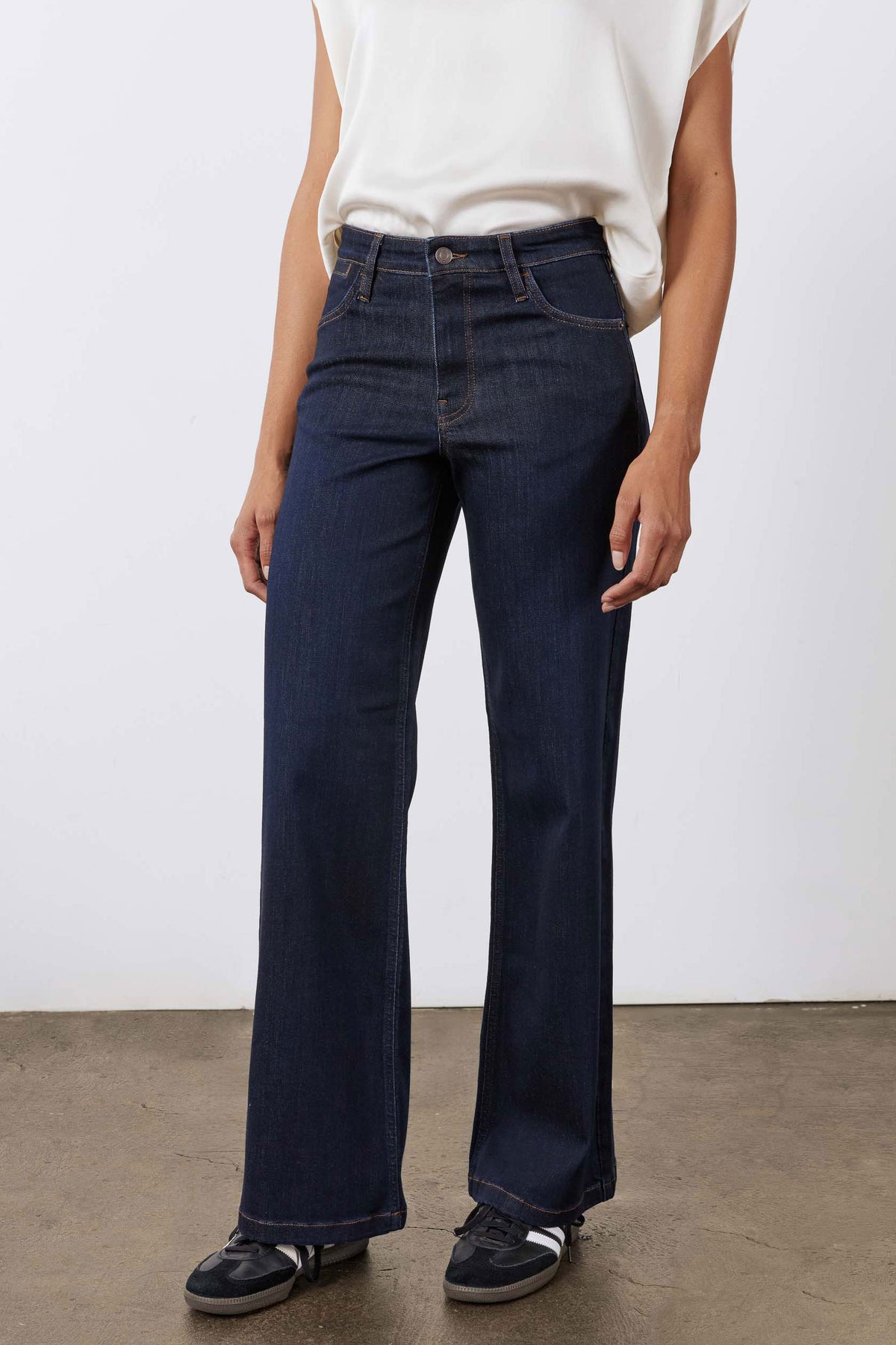 Dark blue denim palazzo jeans front view with straight wide legs and button closure