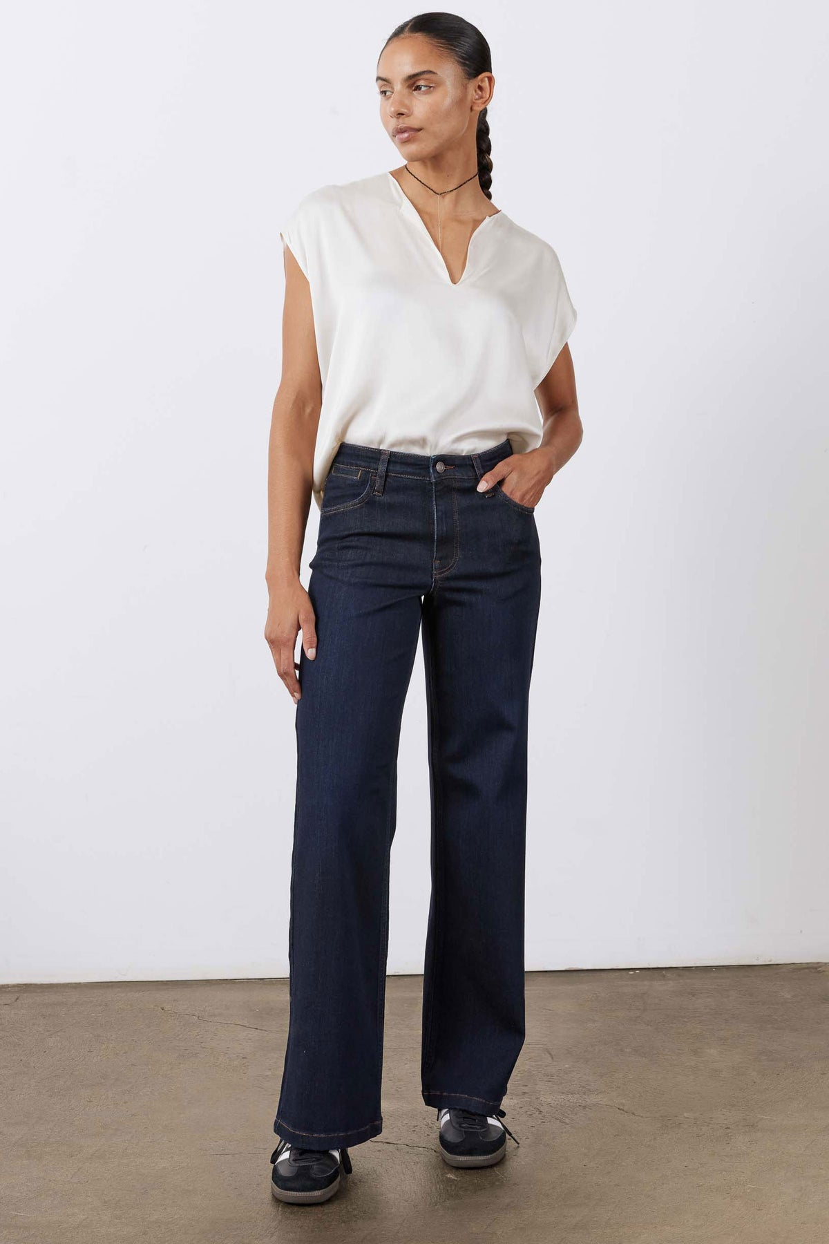 Women's palazzo jeans in dark blue wash with belt loops, front button, and wide legs